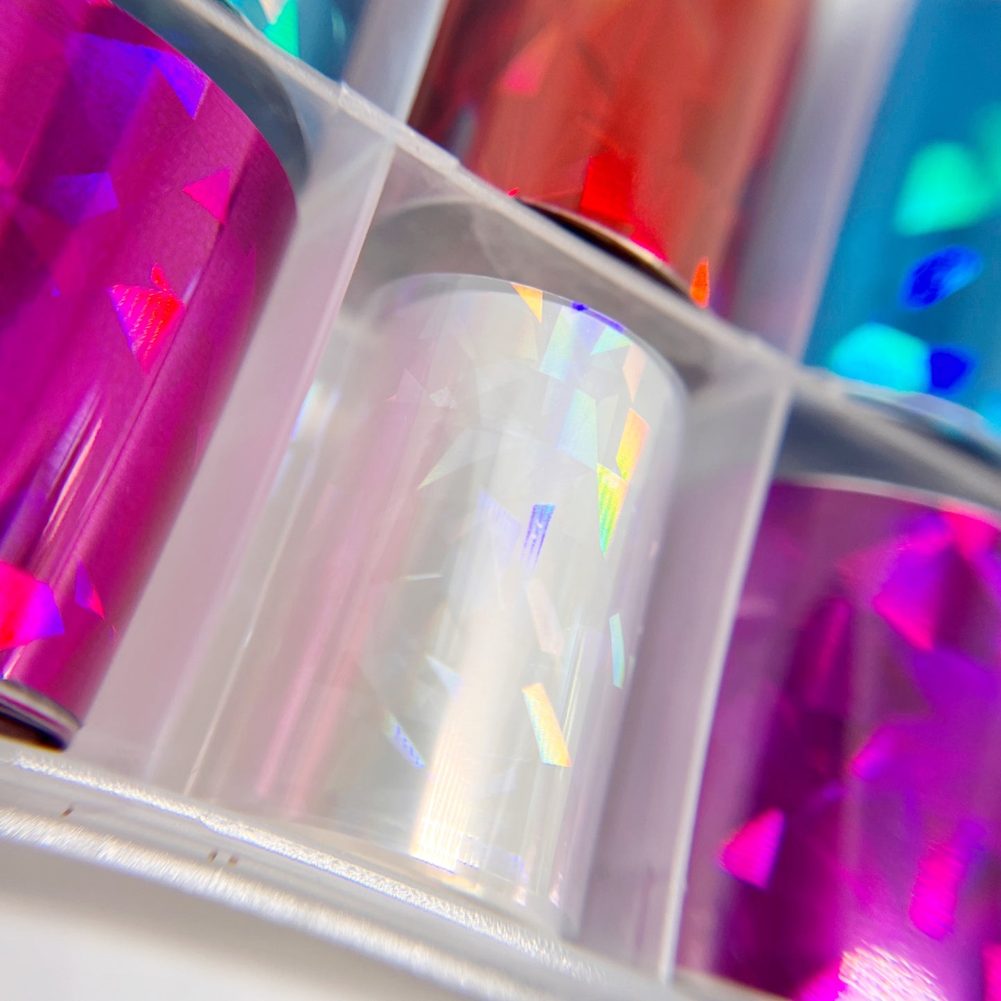Close-Up of Jewel Foil Set - Detailed View of 9 Metallic Colors with Jewel Facet Print and 1 Clear Opal.