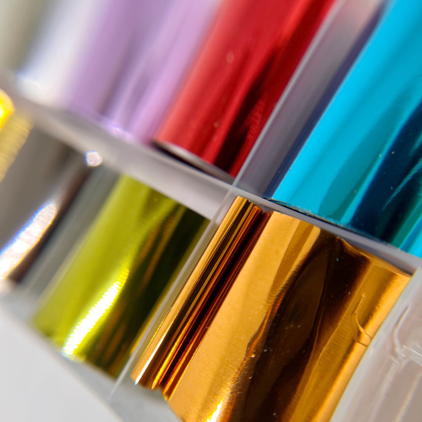 Close-Up of Metallic Foil Set - Detailed View of 10 Solid Metallic Foils in Various Shimmering Colors.