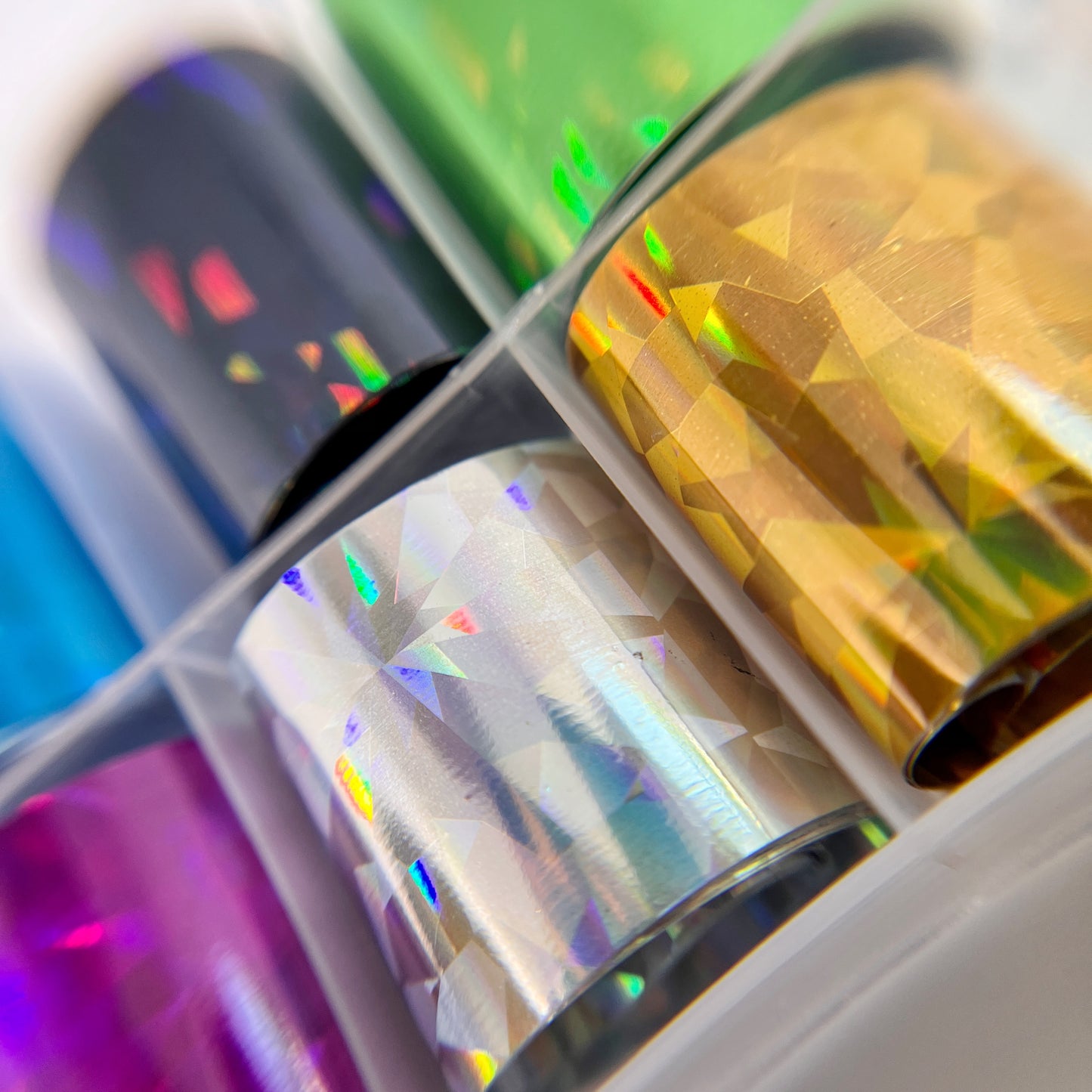 Close-Up of Jewel Foil Set - Detailed View of 9 Metallic Colors with Jewel Facet Print and 1 Clear Opal.