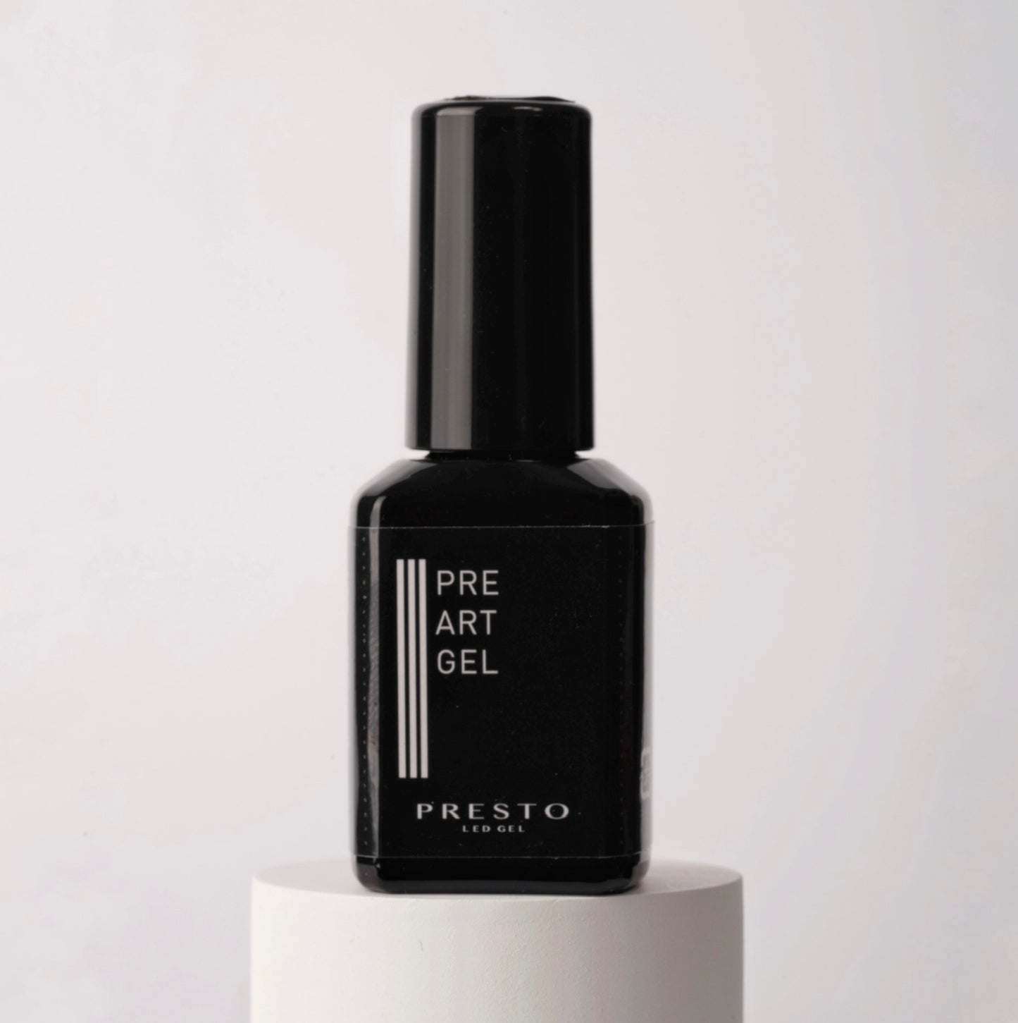 Black gel polish bottle on white stand on white background.