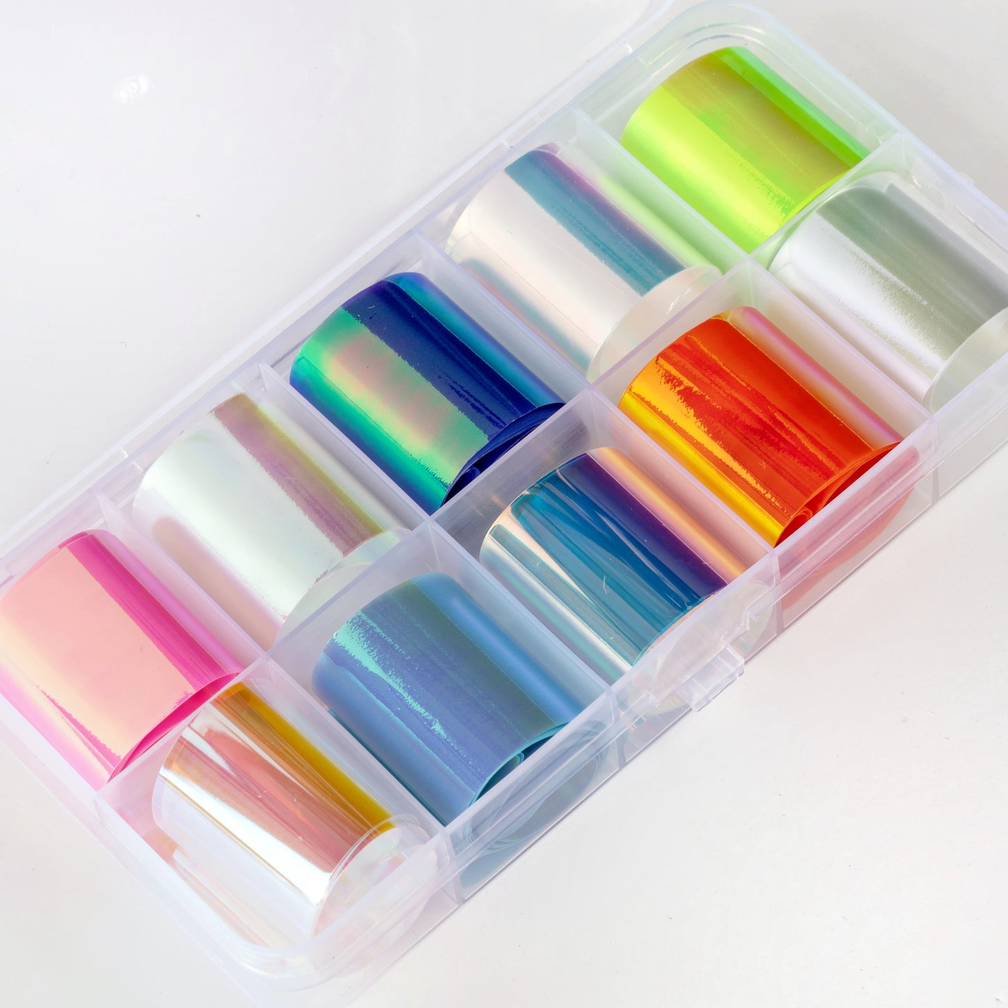 Multicolor hologtaphic foil in case on white background.