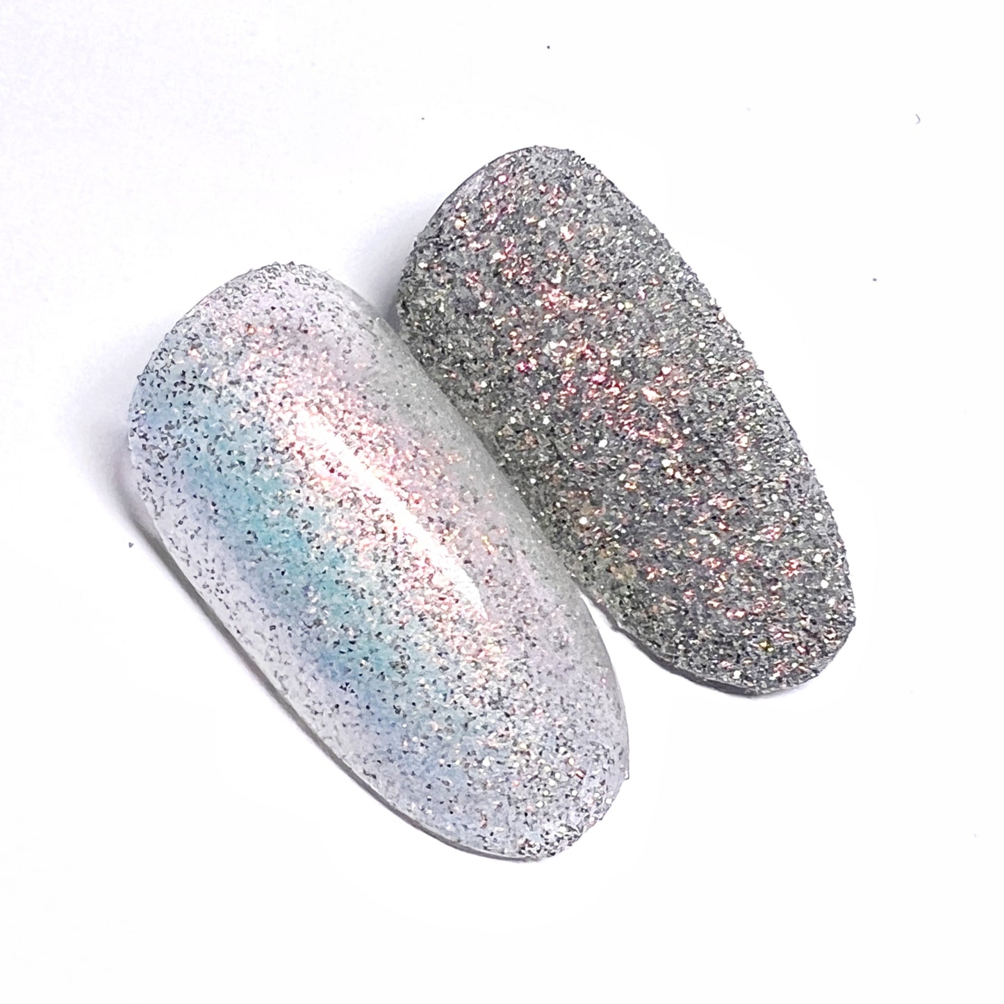 Decorated nail tips on white background.