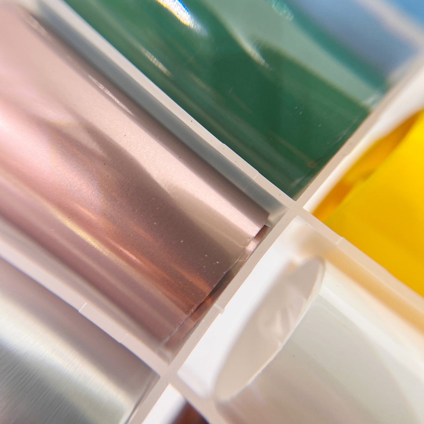 Close-Up of Metal and Gloss Foil Set - Assortment of Solid Gloss and Matte Metallic Transfer Foils in Various Vibrant Colors