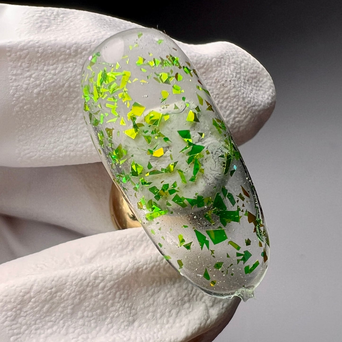 Hand holding decorated nail tip