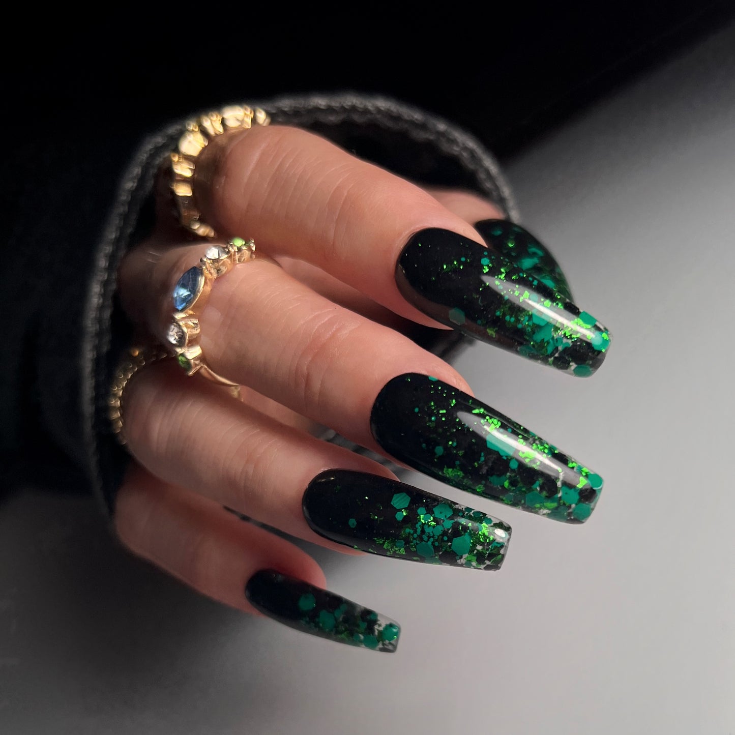 Nail art example on long black nails.