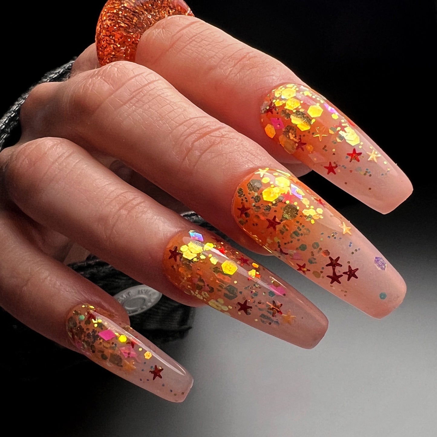 Still image of hand with long nails.