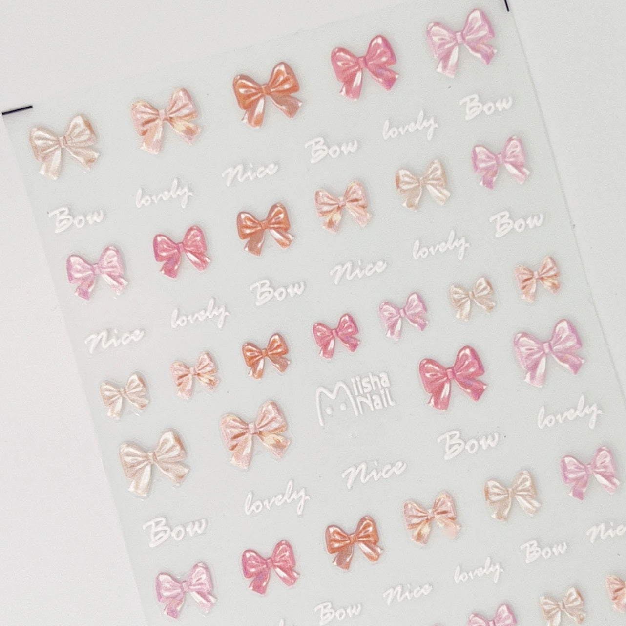 Pink and peach bow embossed nail stickers.