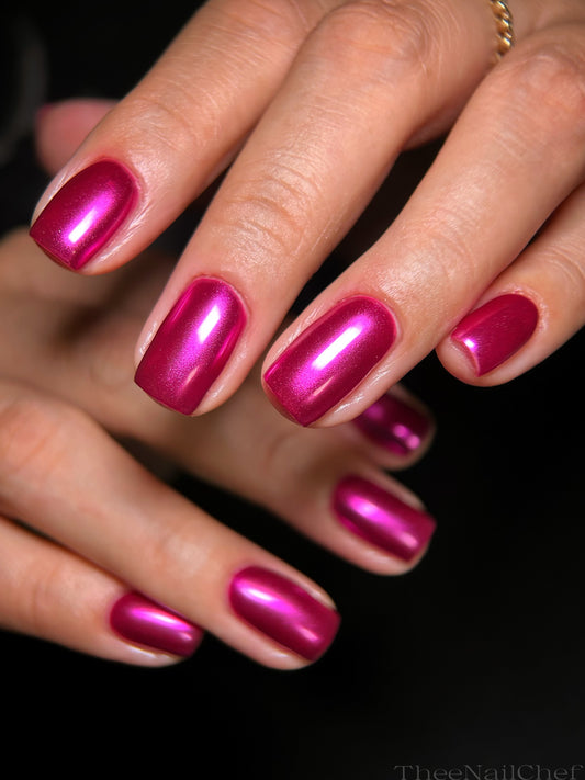 Hot pink chrome manicure by Jennie Guthrie using Vacation Nail Shop Cyber Pink Chrome, shown on short natural nails with a bright metallic finish.