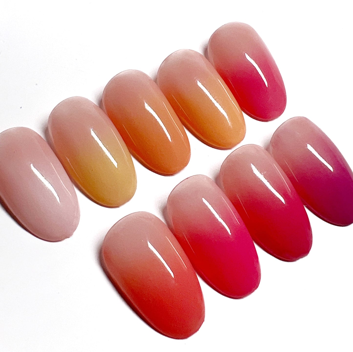 Decorated nail tips on white background.