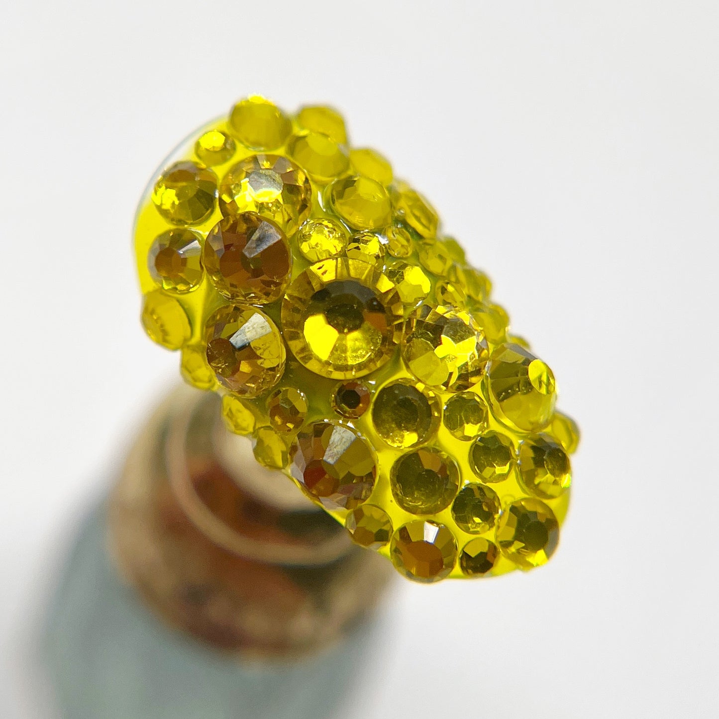 Decorated nail tip on white background.