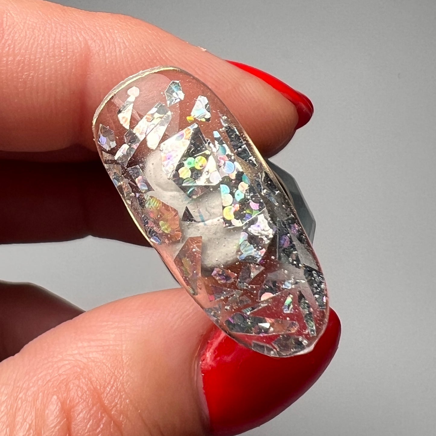 Large silver hologaphic mylar flakes for nail art.