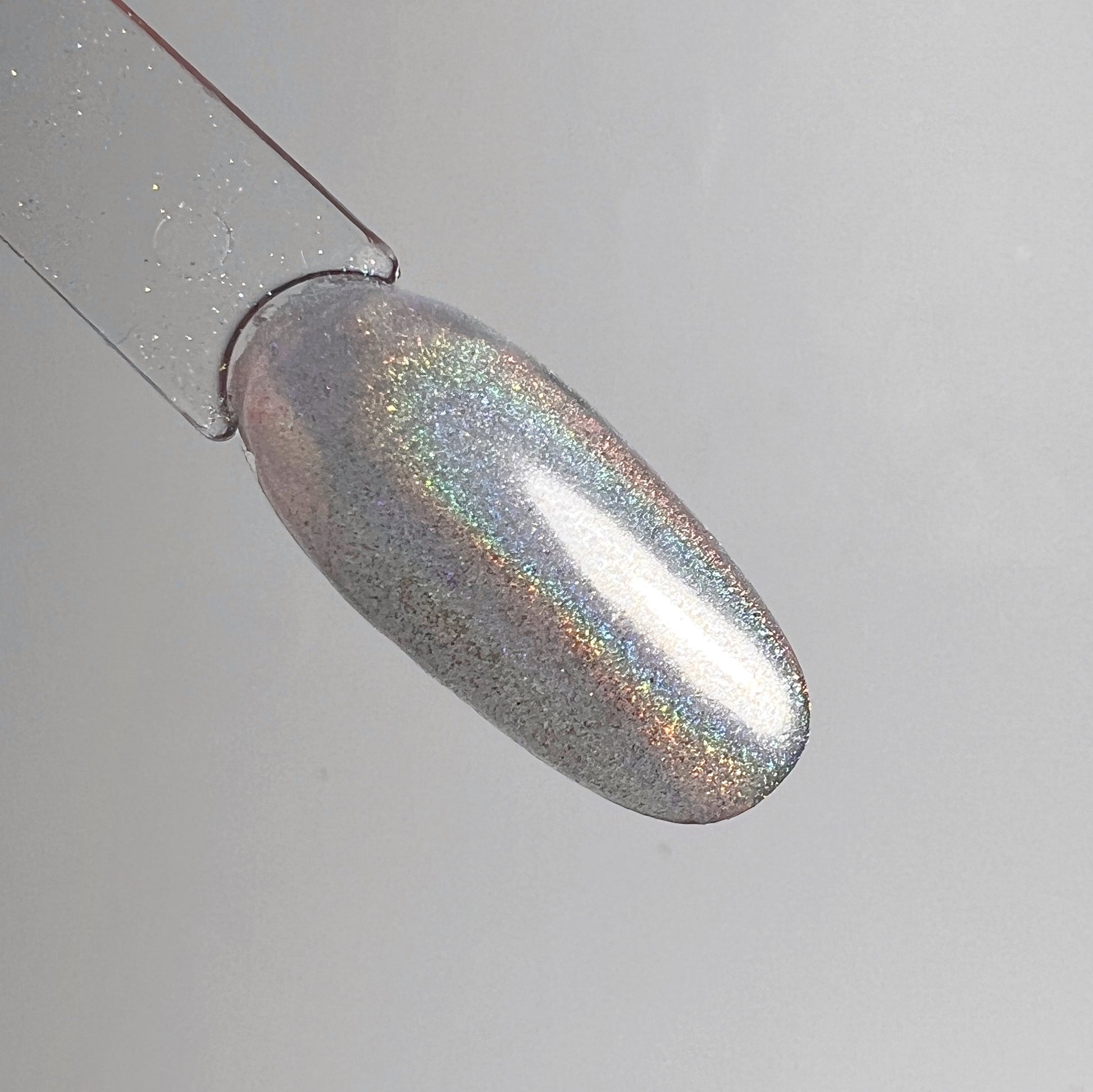 Chrome swatch on clar oval nail swatch stick.