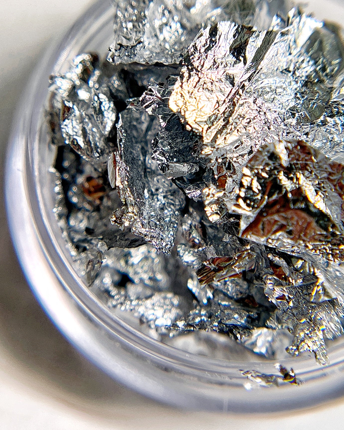 Silver colored foil leaf flake for nail art.