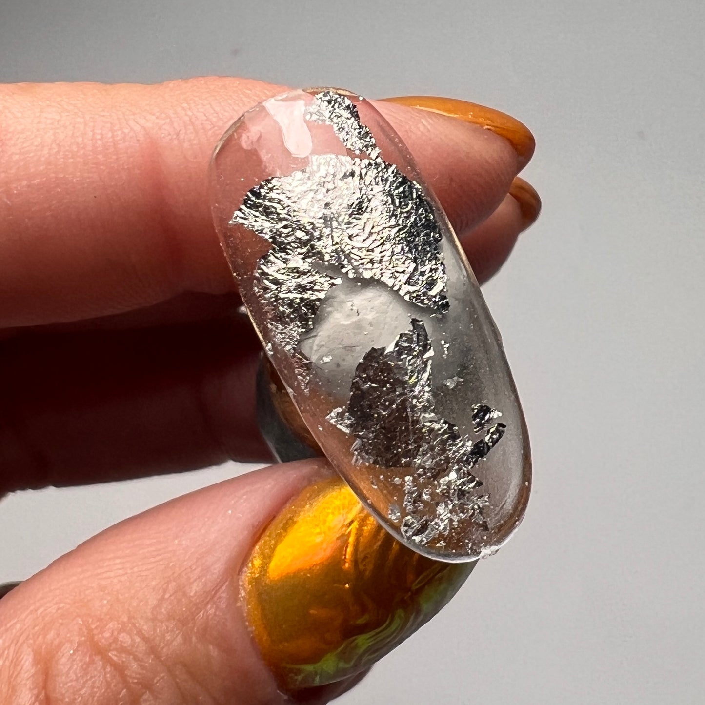 Silver colored foil leaf flake for nail art.