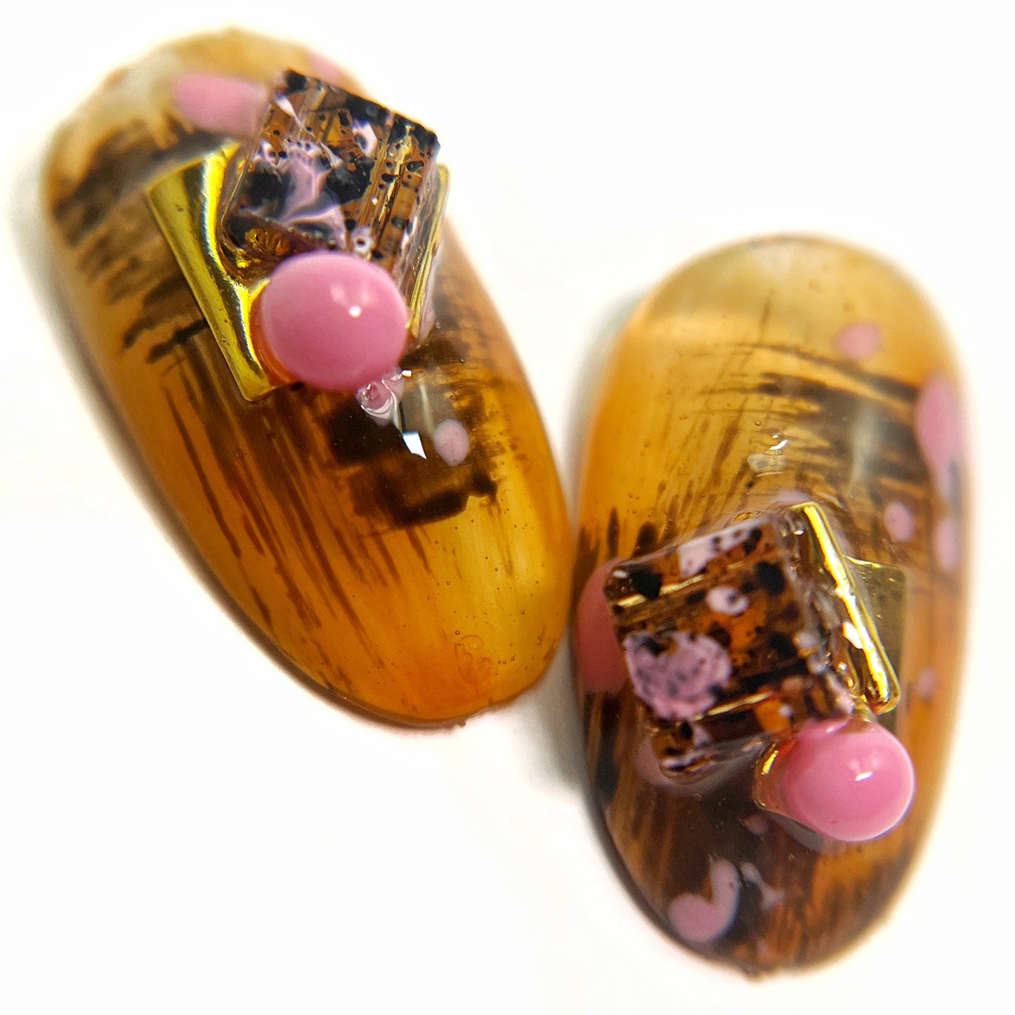 nail art tip featuing 3d elements on white background.