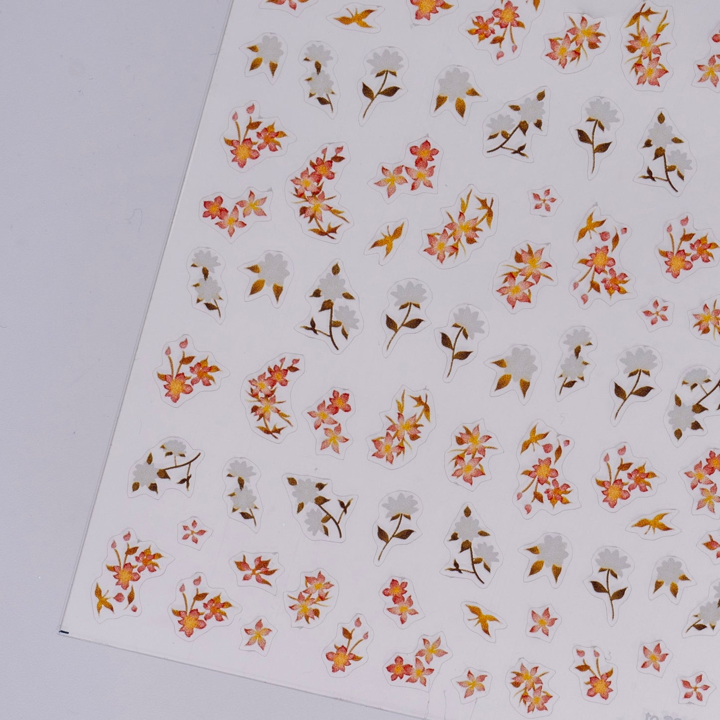 Sheet of floral stickers with small flowers on a white background