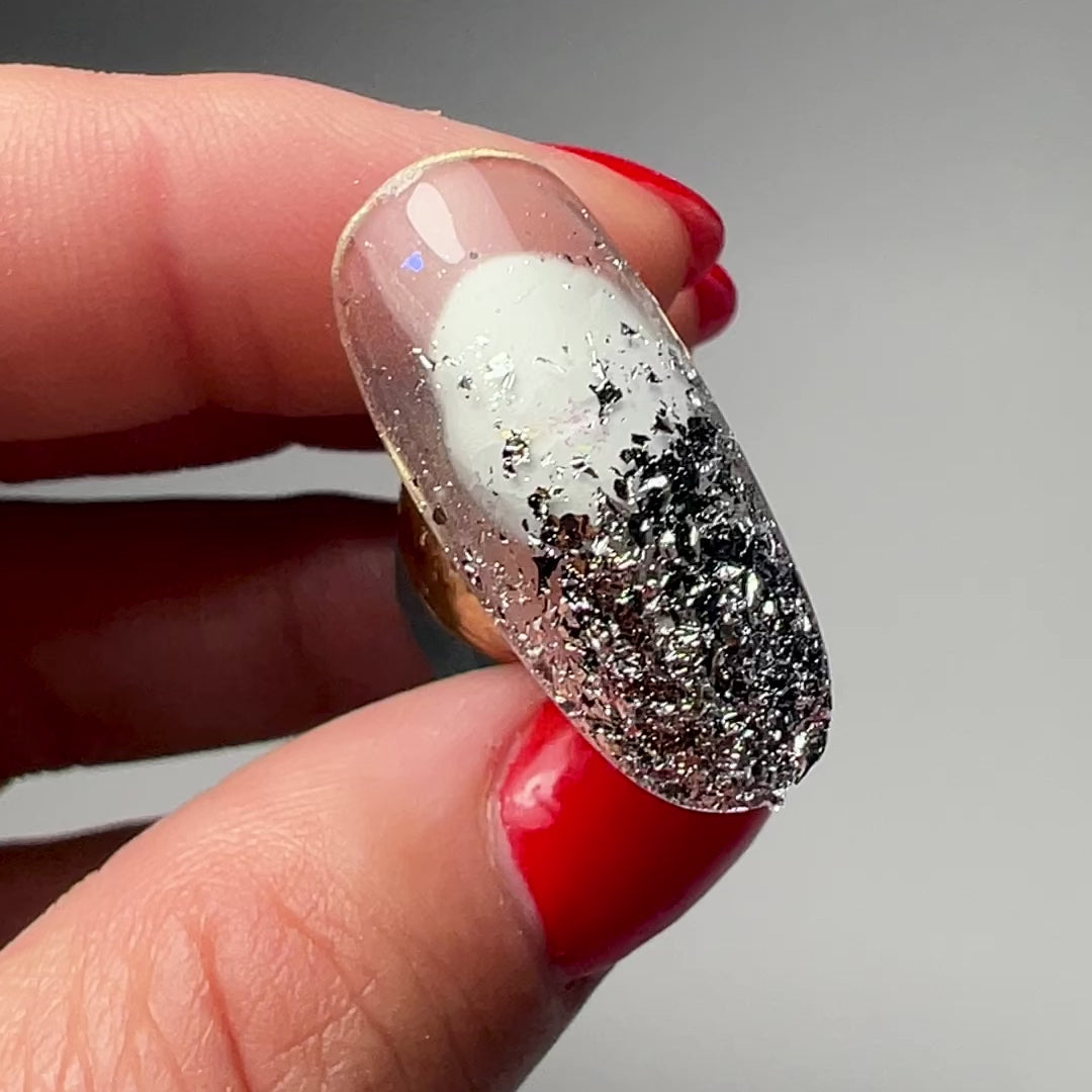 Thin silver foil flakes for nail art.