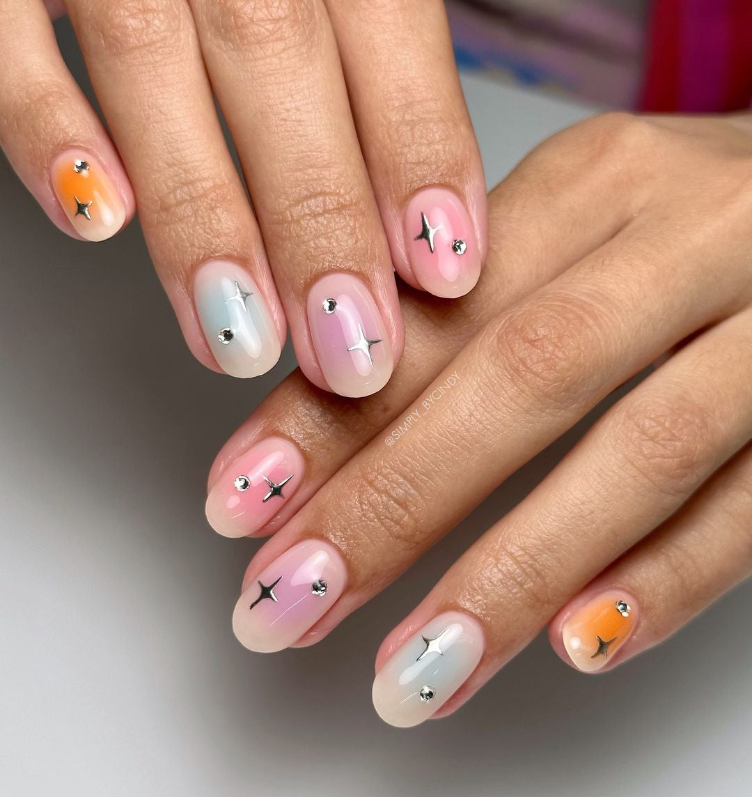 Manicured hands with nail art on light backgrounf