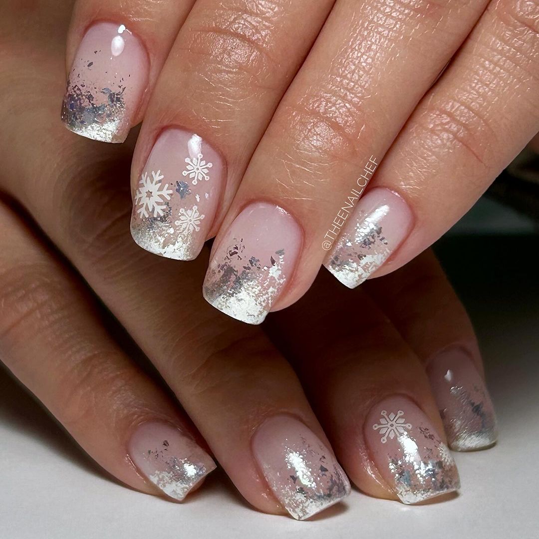 Nails with pink and silver glitter design on a neutral background