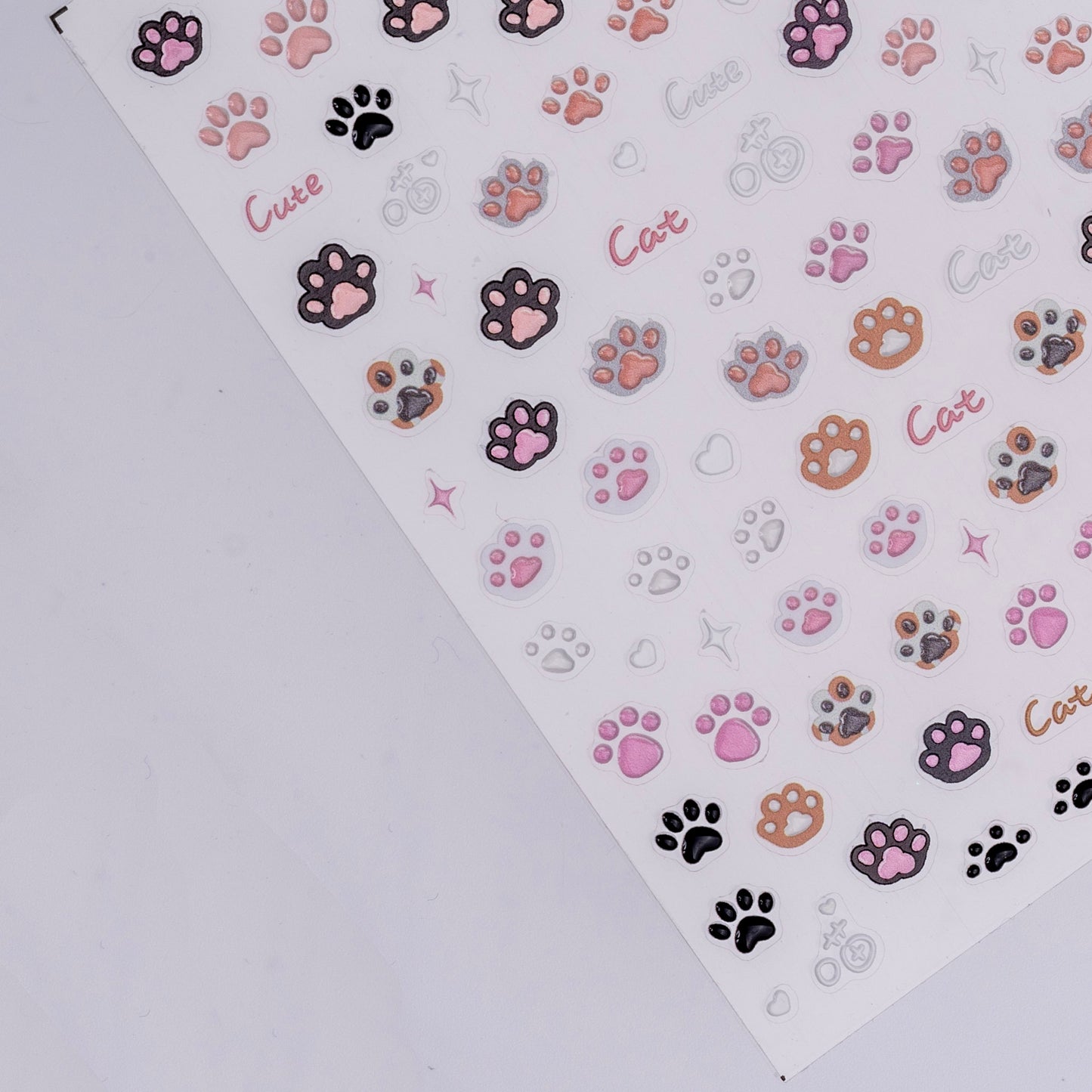 Sheet of colorful paw print stickers with 'Cat' text on a white background