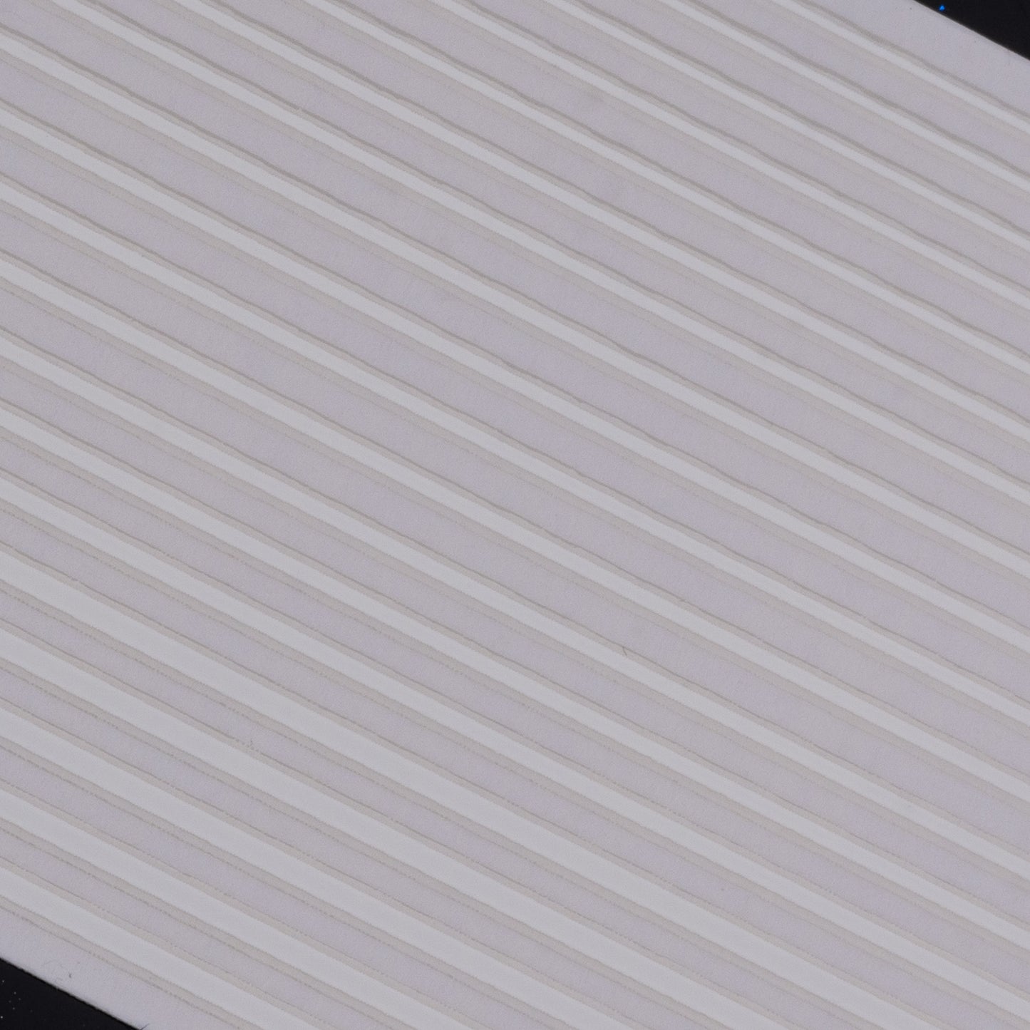 Close-up view of white line nail stickers on white background.