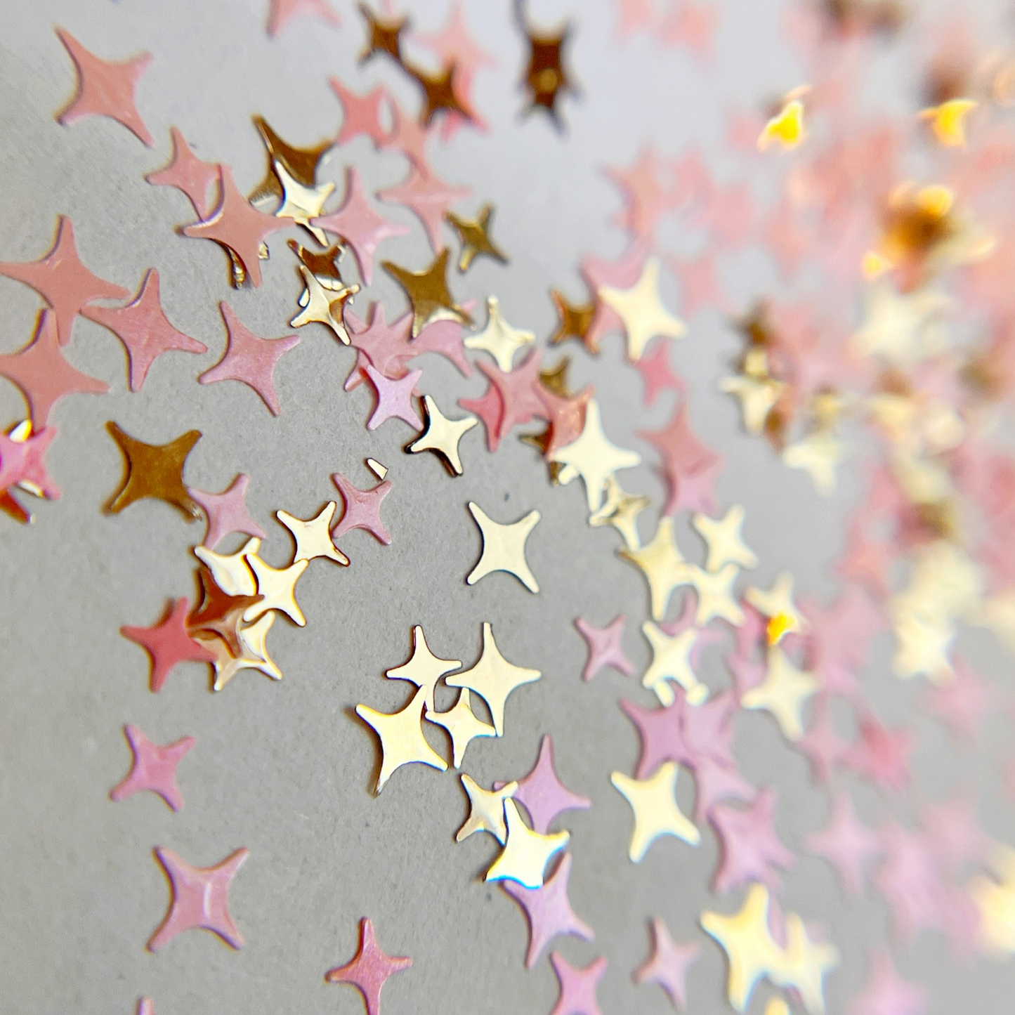 Glitter mix scattered on white background.