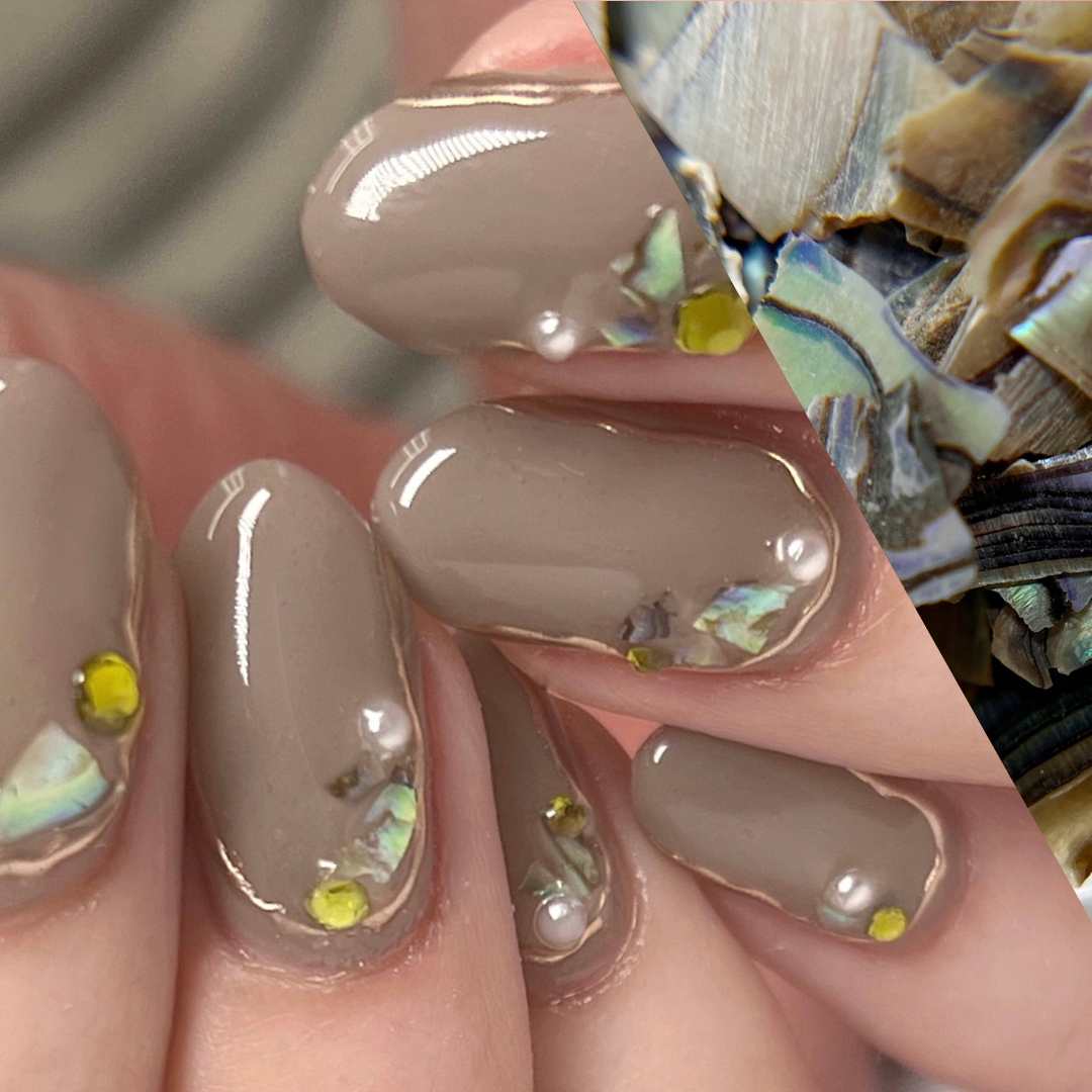 image of hands with nail art and a diagonal swatch of a close up of shell colior. 