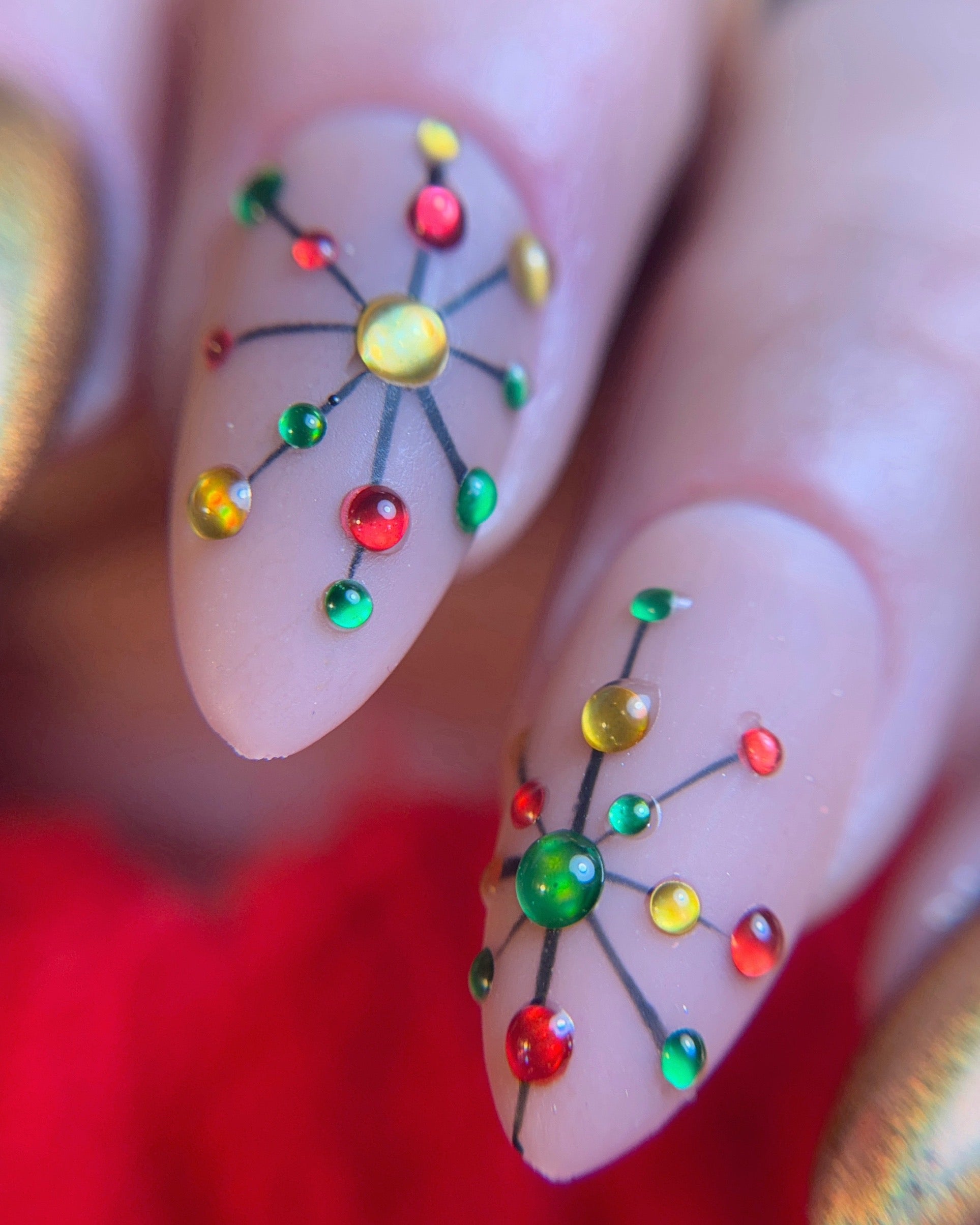 Nails with colorful design on a blurred background