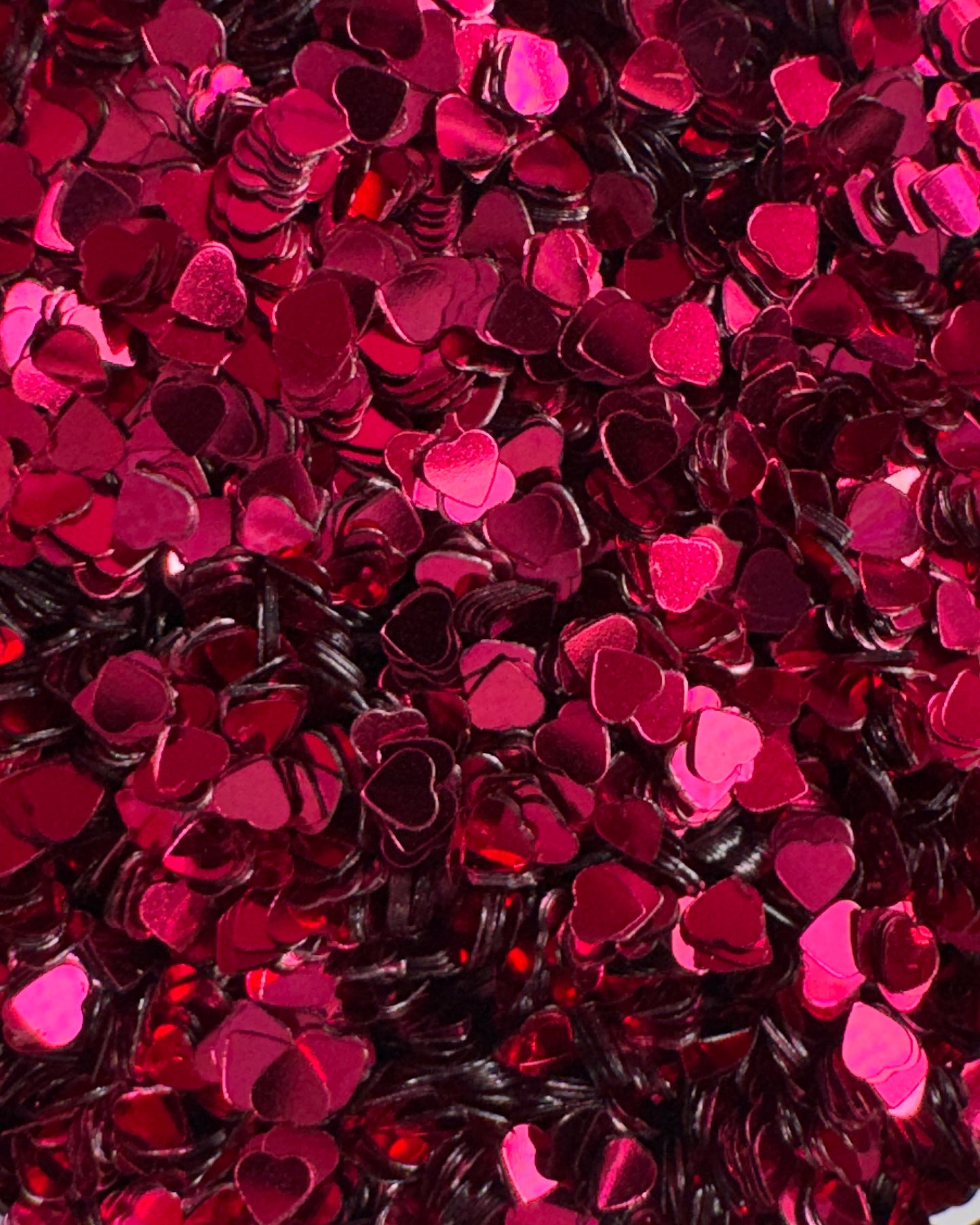 Close-up view of pink heart glitter.