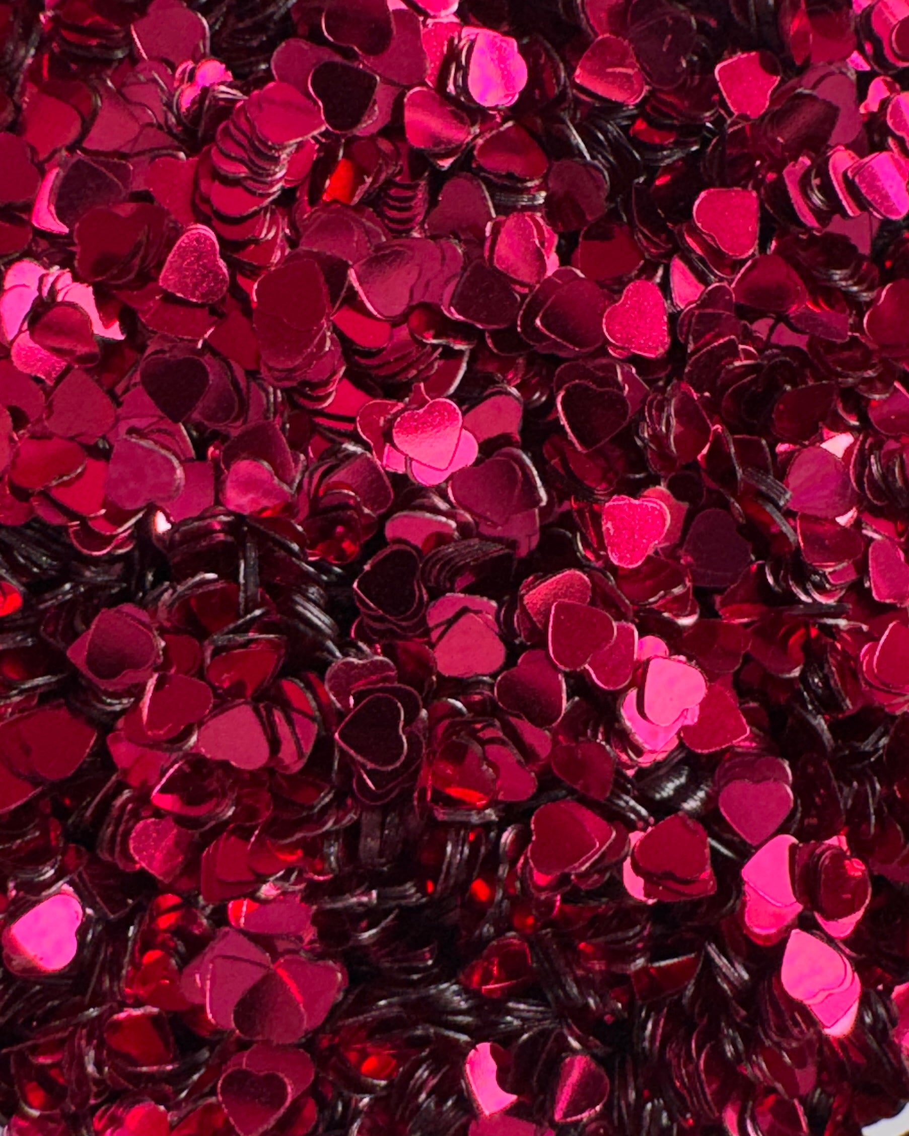 Close-up view of pink heart glitter.