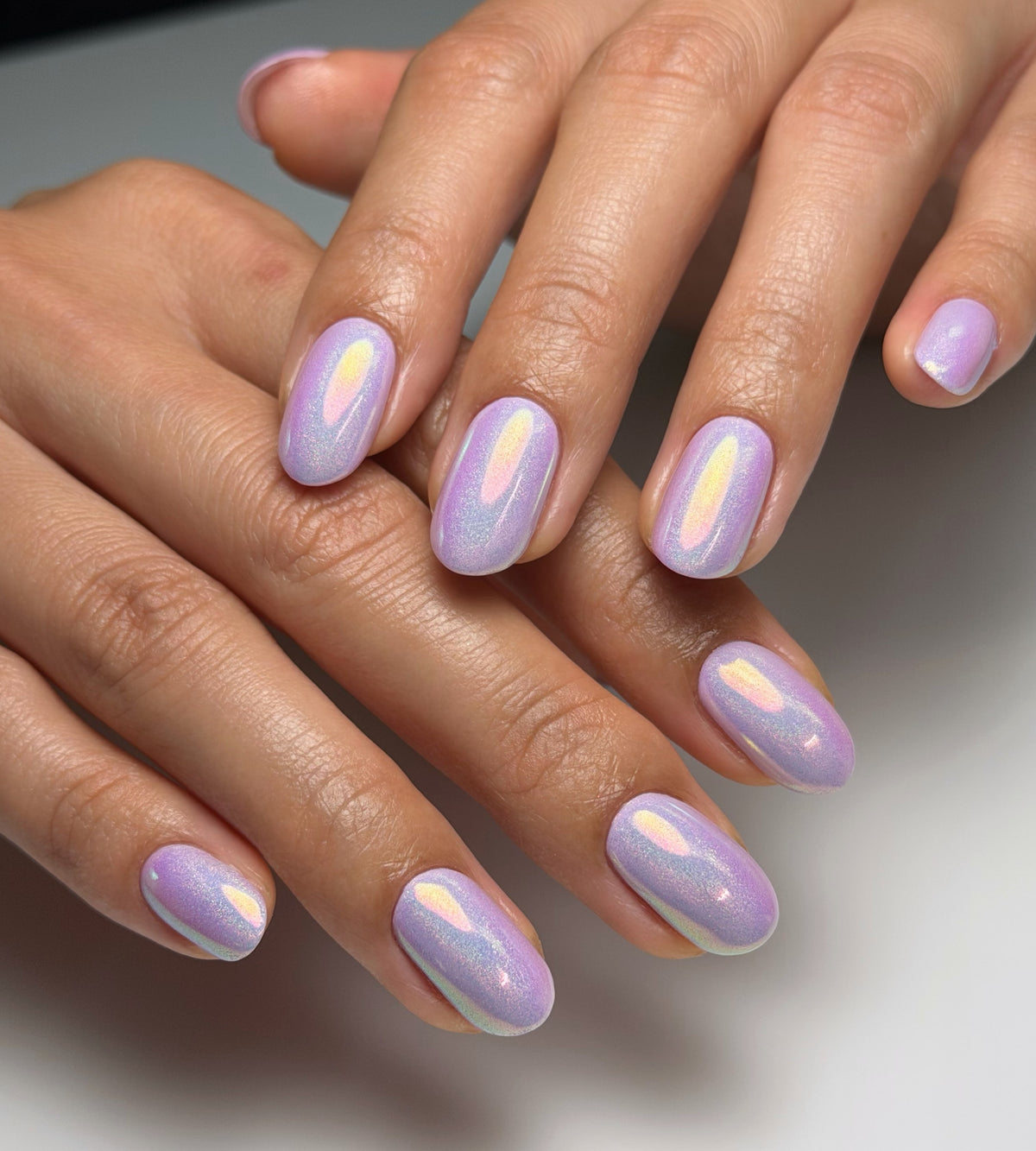 Lavender opal chrome manicure by Cindy Trieu using Vacation Nail Shop Opaline Chrome, with a soft iridescent pink, gold and blue shift on short natural nails.