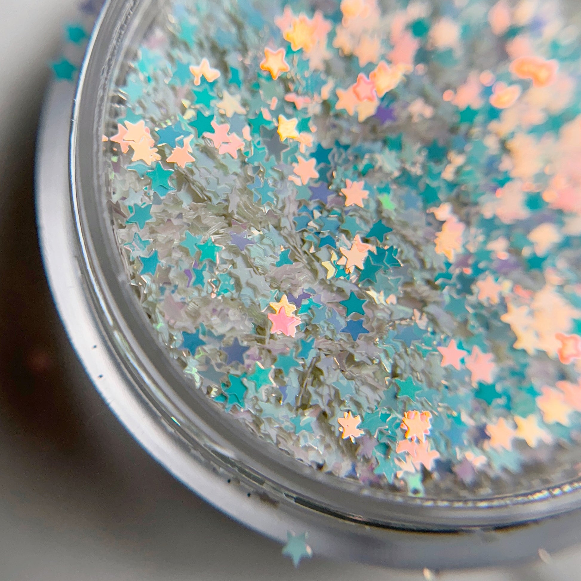 Close up of star glitter in clear container.