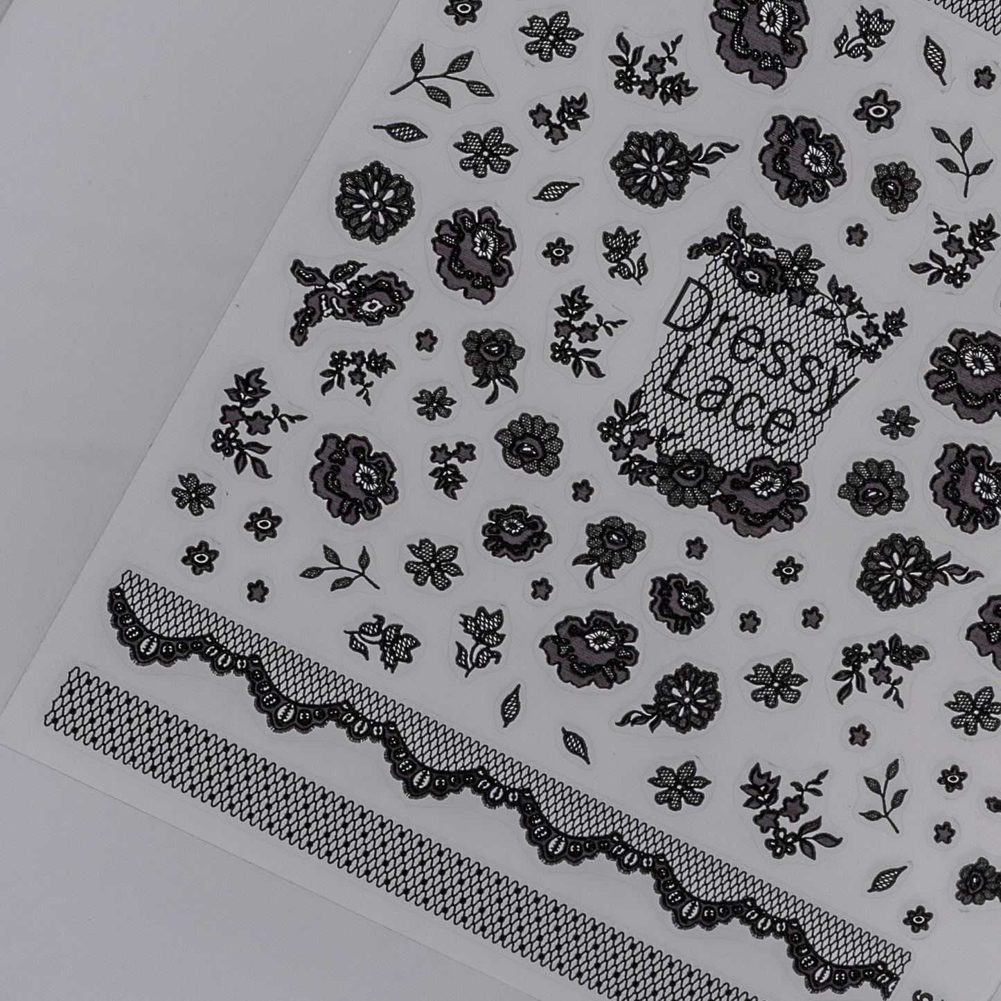Black floral and lace pattern nail sticker sheet  on a white background