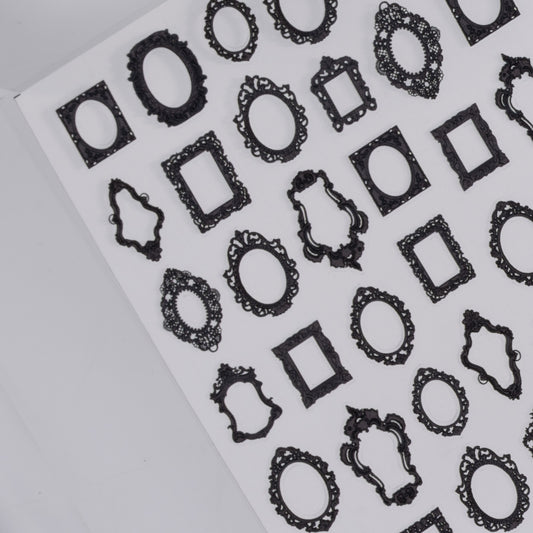 Sheet of black decorative frame nail stickers a white background