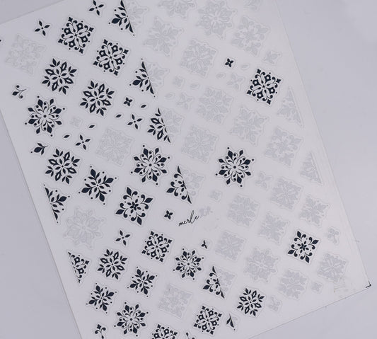Nail decal sheet with black and white design on white background.
