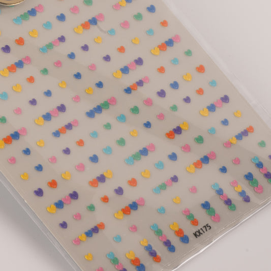 Sheet of colorful heart-shaped stickers on a clear background