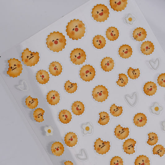 Sheet of small round stickers with cartoonish designs on a white background