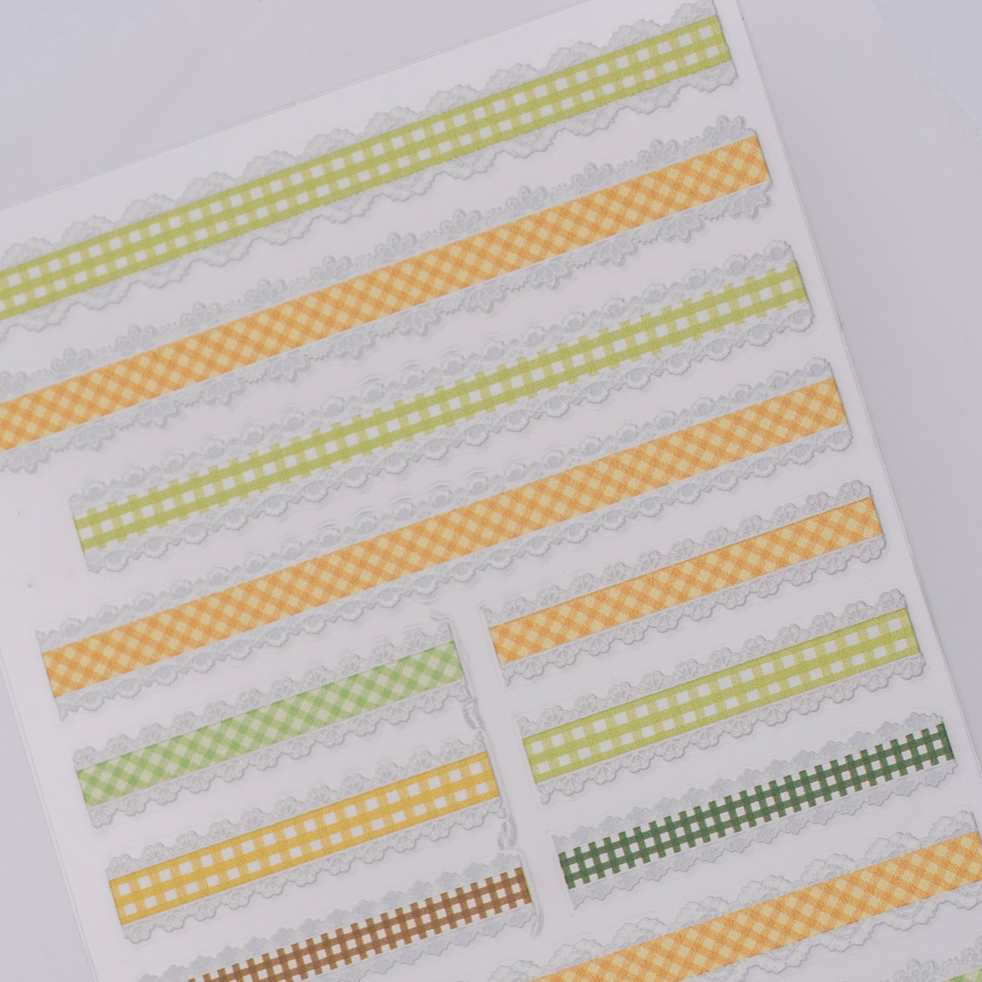 Checker design nail stickers on white background.