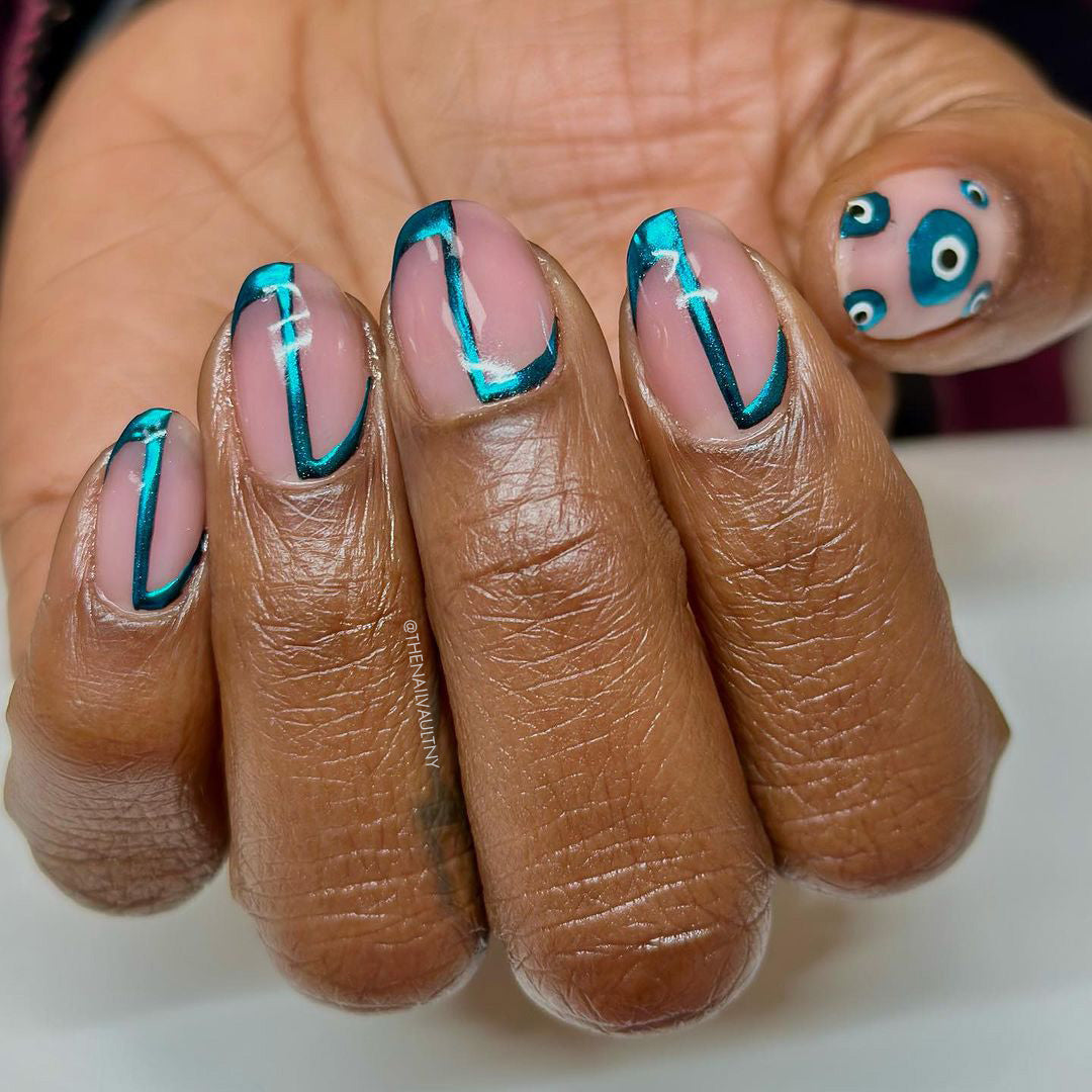 Manicured hand with detailed nail art