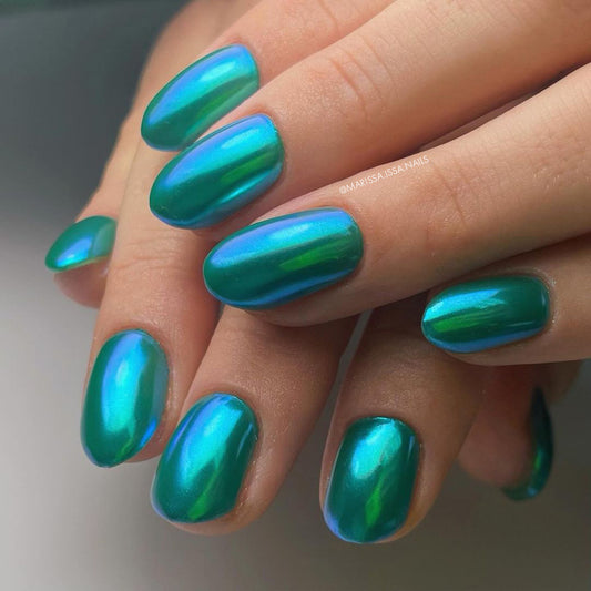 Hand metallic nail comlr on a neutral background