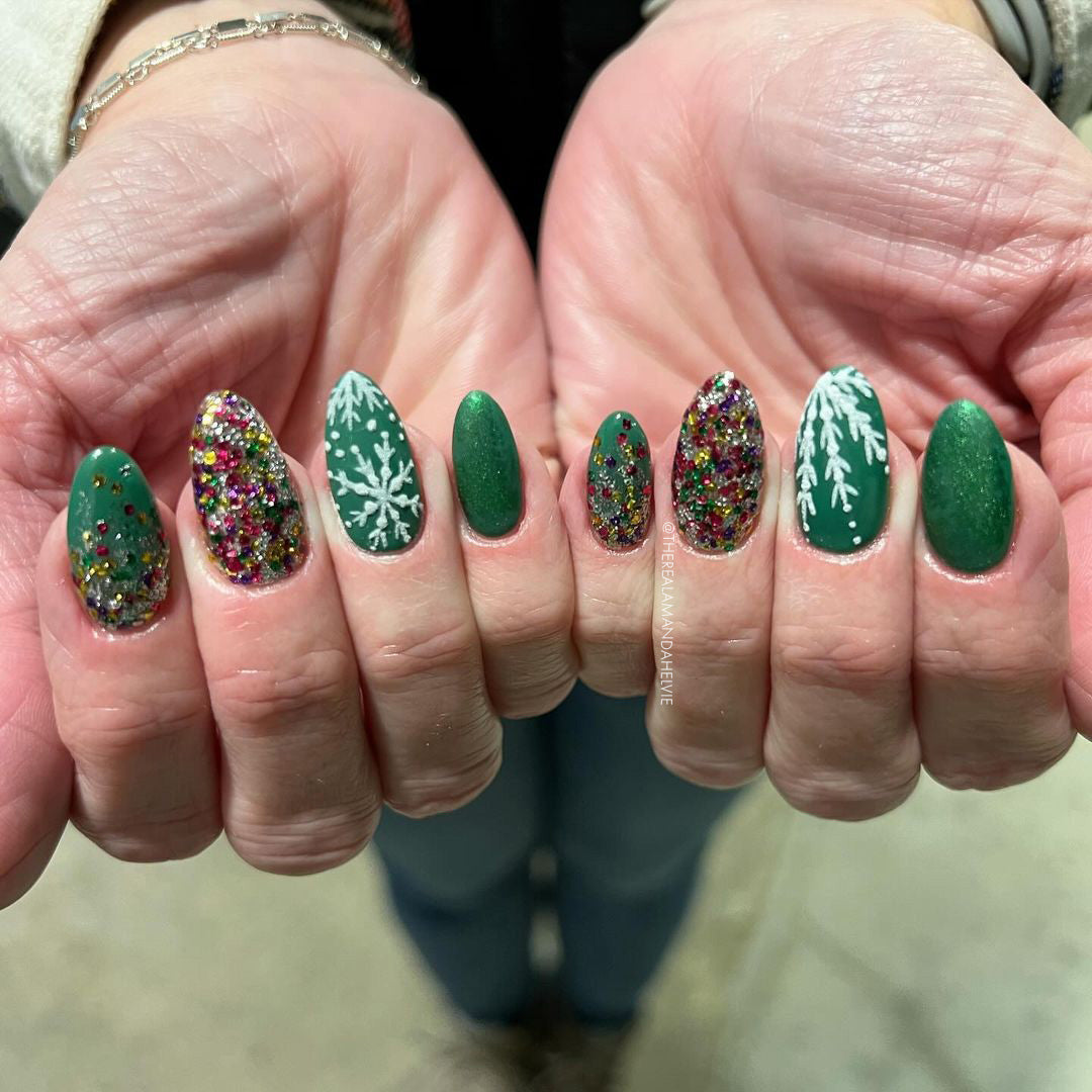 Hands with festive nail glittery nail desigs
