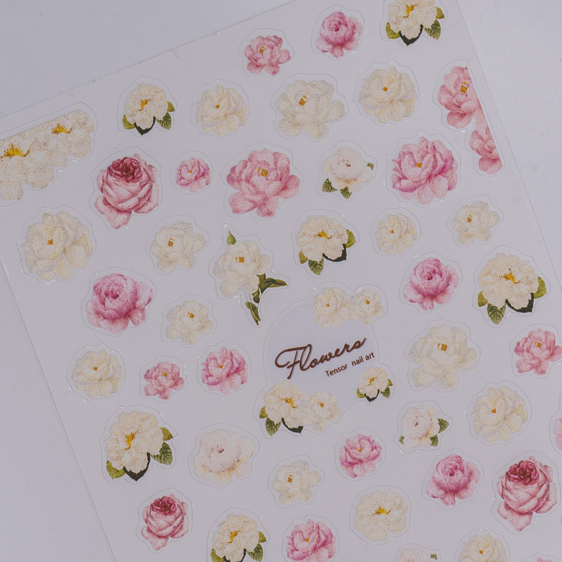 Sheet of floral stickers with pink and white flowers on a white background