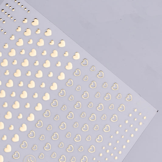 Pattern of gold hearts on a light purple background