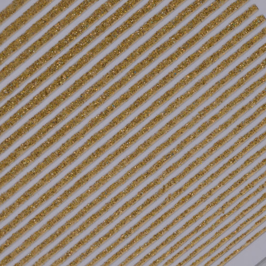 Close-up view of glitter line nail stickers on white background.