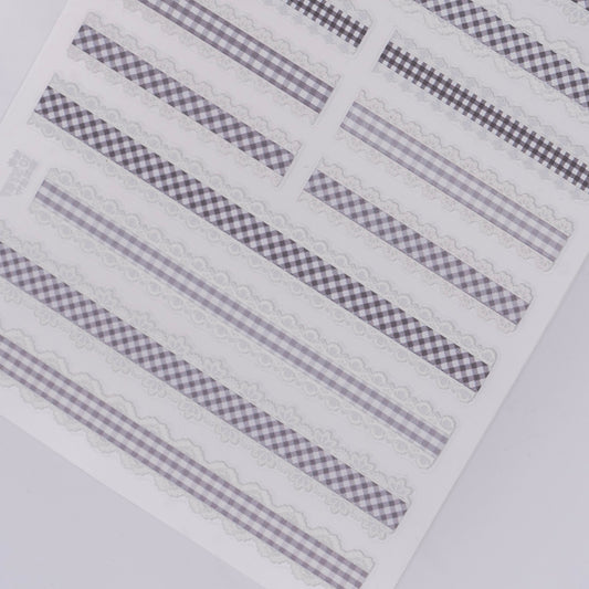 Checker design nail stickers on white background.