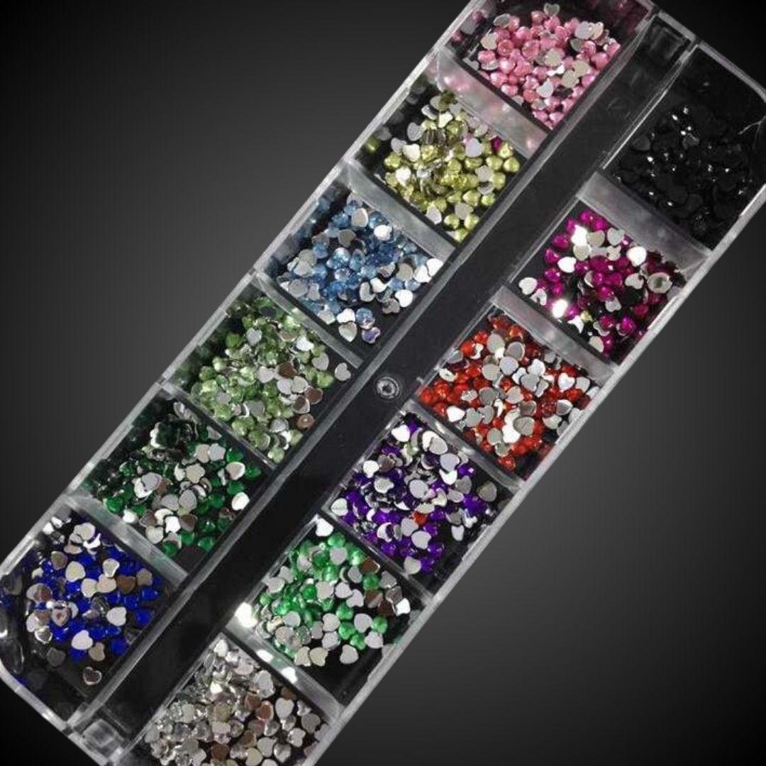 Box of multicolored rhinestones on a black background