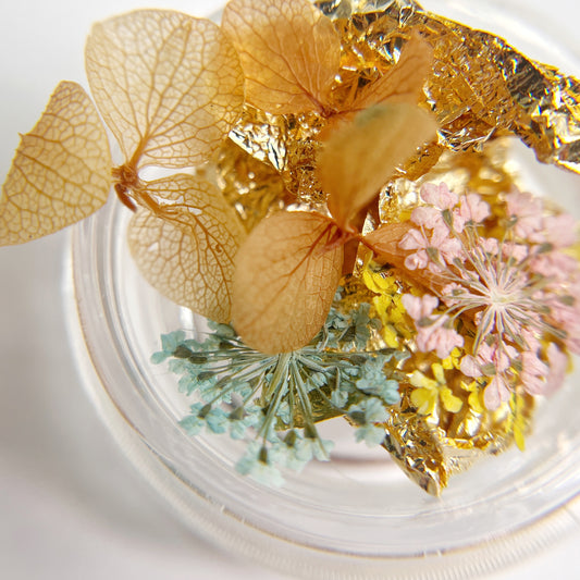 Floral and foil mix on white background.