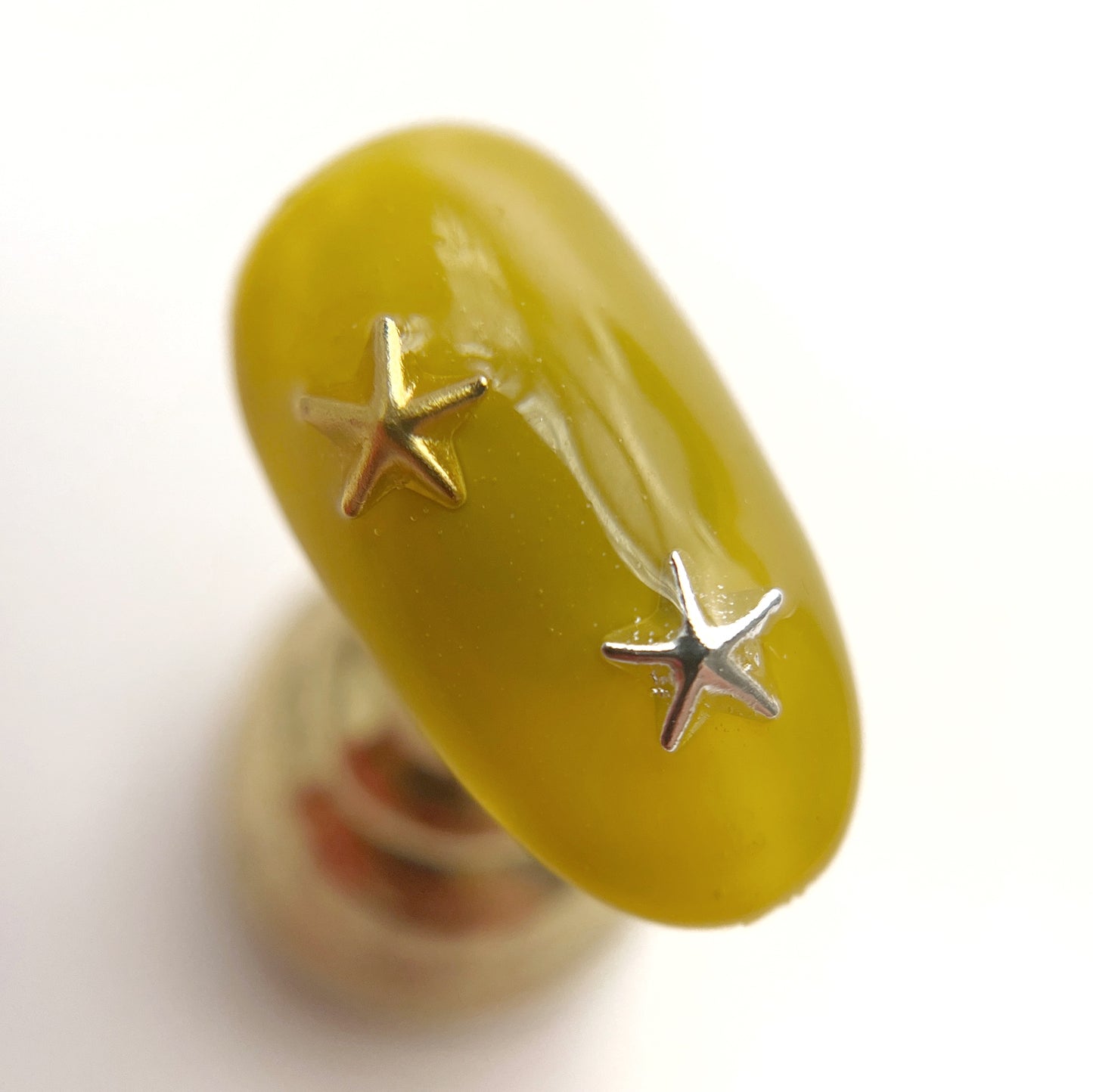 Decorated nail tip on white background. 