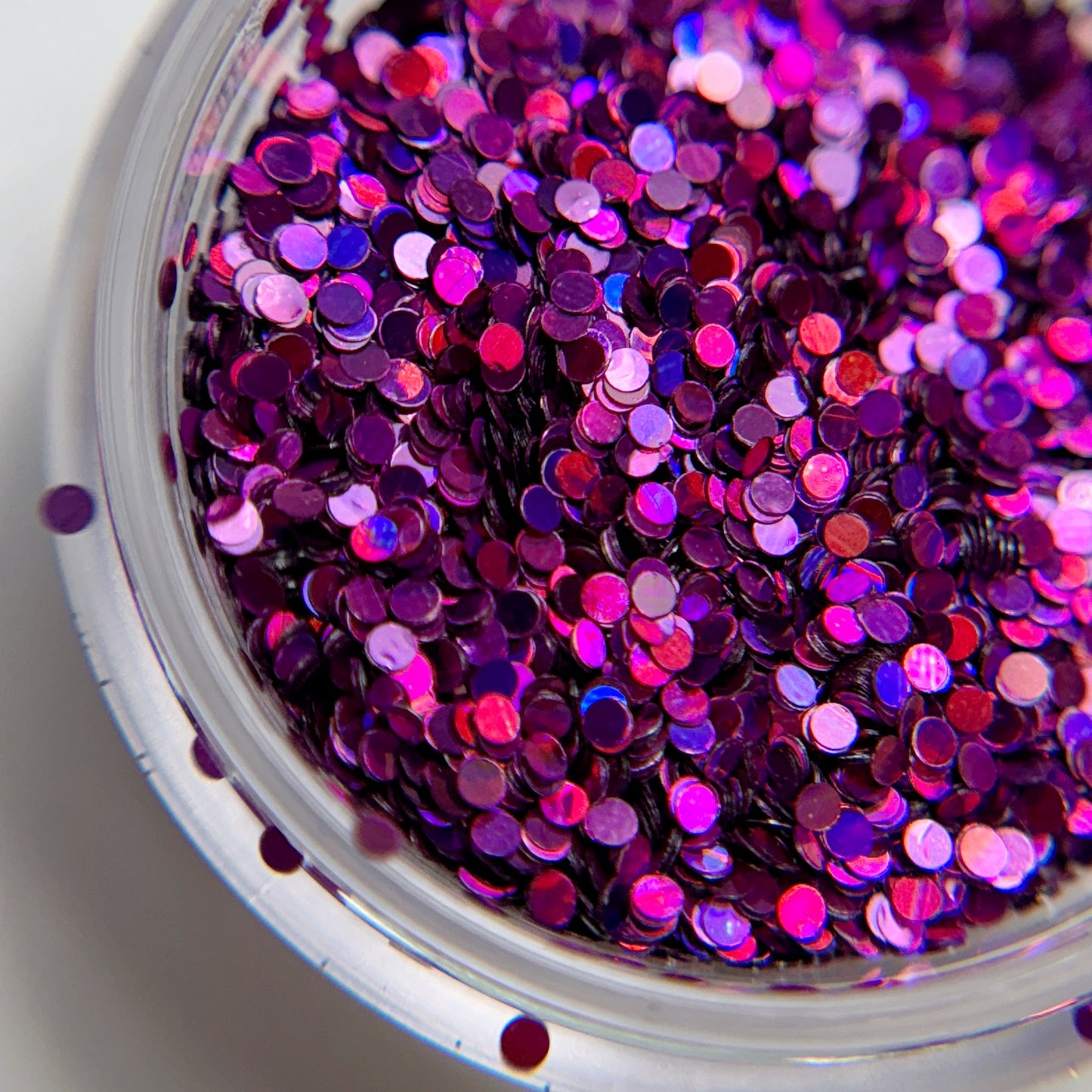 Close up of chunky glitter in clear container.