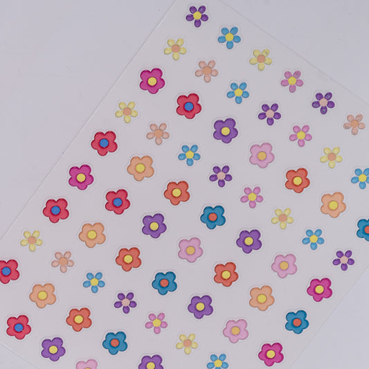Nail decal sheet featuring colorful flowers on light background.